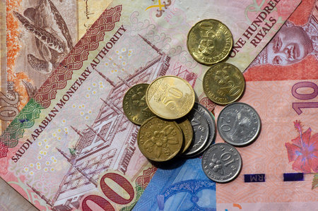 Top view of money, banknote of Ringgit Malaysia, Singapore dollar and Saudi Arabia Riyals for...