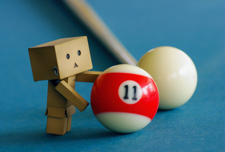 A cute danboard doll with billiard ball number 11, selected focus