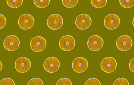 Orange slices on green backgroundの写真素材