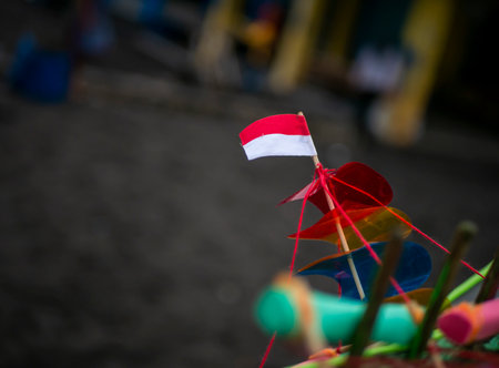 A miniature Indonesian flag in a toy ship, shallow focusの写真素材