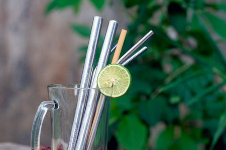 Bamboo and steel straws, an alternative to reducing plastic straws. The concept of reducing non-degradable plastic waste.の写真素材