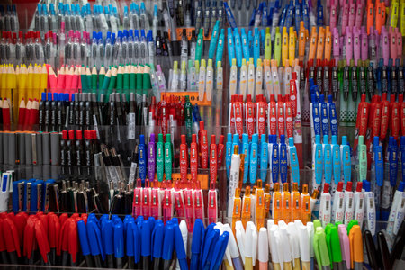 Assortment of colorful pen stored in rack, in a bookstore.の写真素材