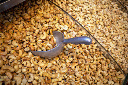 Cashew nuts and a scooping spoon at a food shop in Makkah city, Saudi Arabia.の写真素材