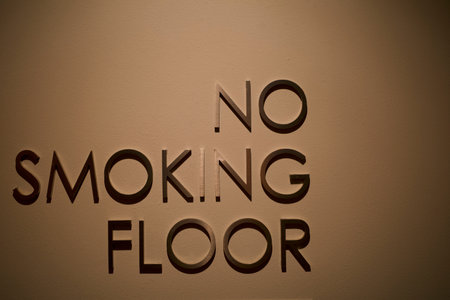 Brown wall with text No Smoking Floor, to inform this floor is protected from tobacco smoke, smoking is prohibited.の写真素材