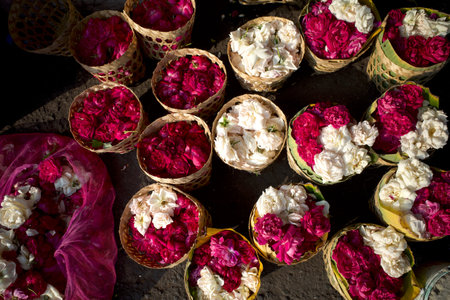 Fresh white and red roses in wicker bamboo basket in traditional market, in Yogyakarta, Indonesia.