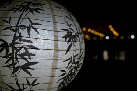 A black and white lantern with bokeh abstract background glow design light texture.の写真素材