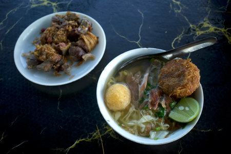 Close up of Soto Ayam, an Indonesian delicious traditional chicken soup.の写真素材