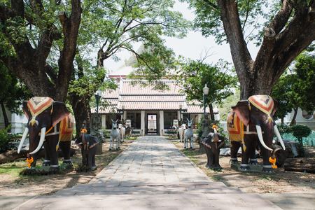 An entrance of the temple with two elephants statue stand in frontの写真素材