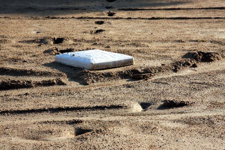 third base after a muddy game of baseballの写真素材