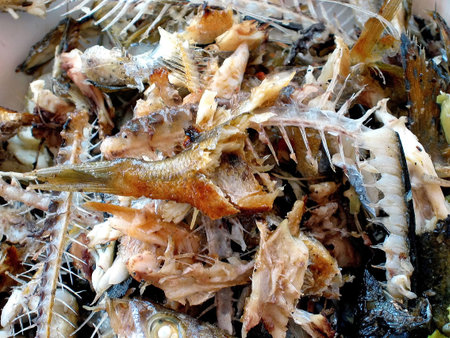 Bony fishes in a plate after barbecue ...