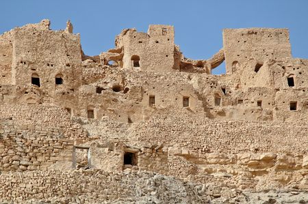 The Dahar plateau is the westernmost tip of the Atlas range. Perched on mountain-tops, the villagers have built their homes literally out of the hillの写真素材