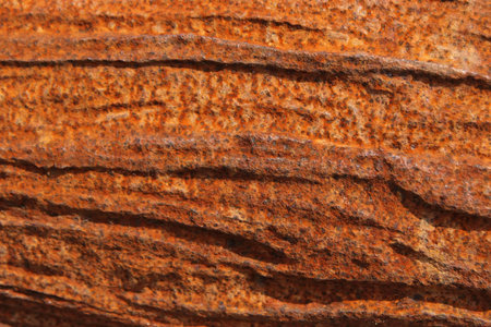 A rusty gullied plaque to be used as backgrounf or texture