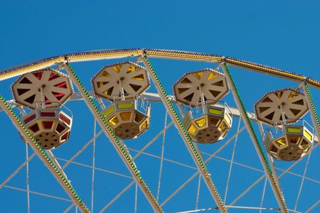 Ferris Wheel against blue sky (detail)の写真素材
