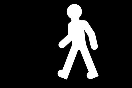Pedestrian roadsign on a black background, ready to paint.の写真素材