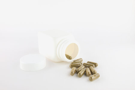Herbal pill and white bottle ,Isolate on white