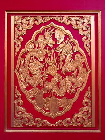  Golden Chinese Dragon in red wall ,temple in thailandのeditorial素材