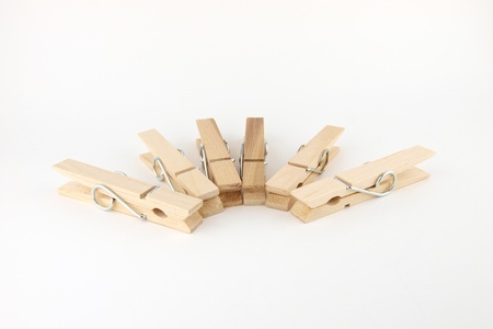 Row of  cloth pegs on whiteの写真素材
