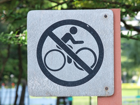 sign meaning "Bicycle are not allowed here" in city parkの写真素材