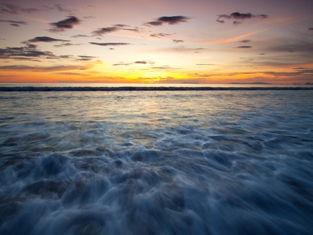 Landscape of sea with dramatic wave in sunset.の写真素材