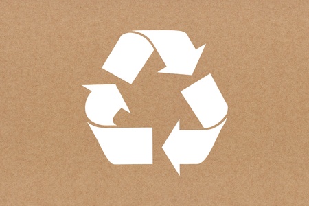 White recycle sign on recycled paper backgroundの写真素材