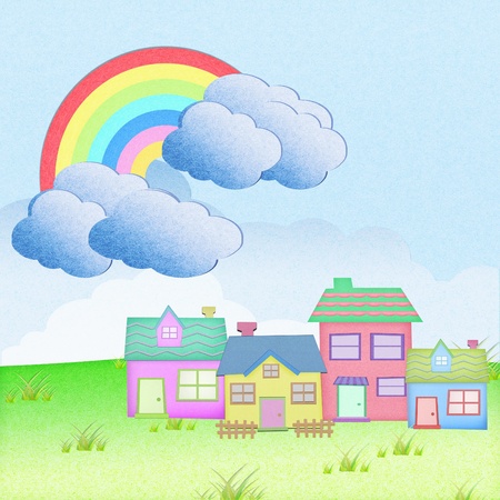 house from recycle paper with grass field rainbow backgroundの写真素材