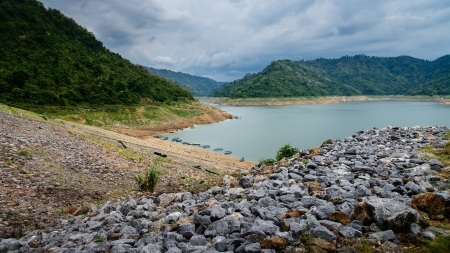 River and mountain backside of Khundanprakanchon dam, Nakhon Nayok, Thailandの写真素材