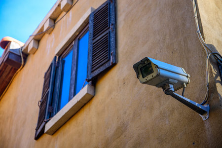 windows with cctv on wall