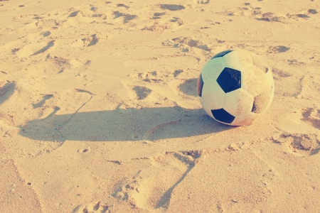 Vintage Soccer ball on sand     の写真素材