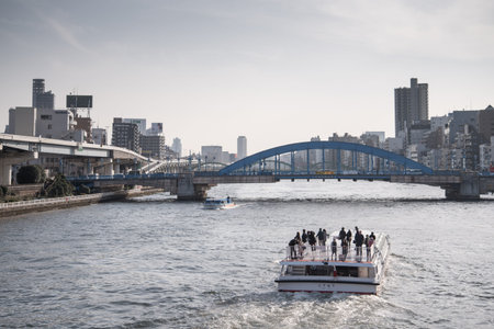 TOKYO - March 28, 2015 : View of The Sumida River at daytime , The Sumida River is a river which flows through Tokyo, Japan. It branches from the Arakawa River at Iwabuchi and flows into Tokyo Bay. on March 28, 2015 in Tokyo Japanのeditorial素材