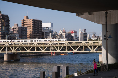 TOKYO - March 28, 2015 : View of The Sumida River at daytime , The Sumida River is a river which flows through Tokyo, Japan. It branches from the Arakawa River at Iwabuchi and flows into Tokyo Bay. on March 28, 2015 in Tokyo Japanのeditorial素材