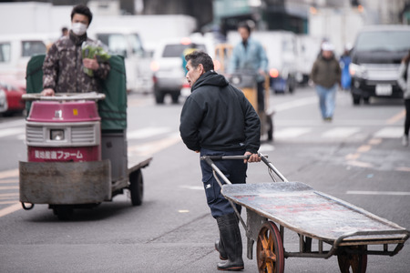 Tokyo, Japan - March 03, 2015: Famous Tsukiji fish market shops. Tsukiji is the biggest fish market in the world, with a vast varaiety of Fish and Sea foodのeditorial素材