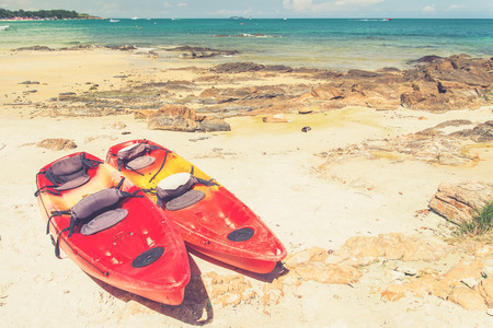 Kayaks on the tropical beach, Mu Koh Samet - Khao Laem Ya National Park, Rayong, Gulf of Thailand coast (Vintage filter effect used)の写真素材