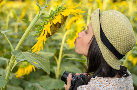 Girl in the sunflowers field with sunflowersのeditorial素材