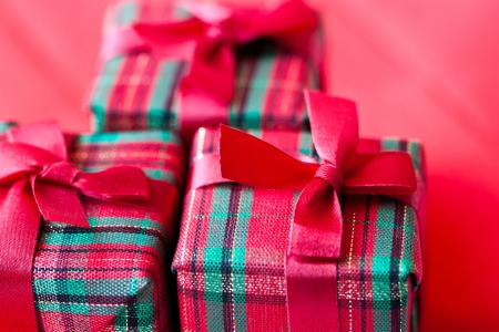 Christmas gift box on red backgroundの写真素材