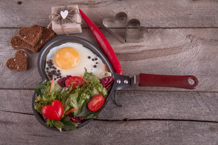 Breakfast for a loved one, scrambled eggs with green saladの写真素材