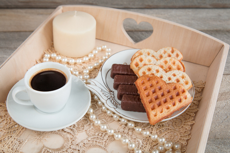 breakfast. Coffee with candy and cookies in heartの写真素材