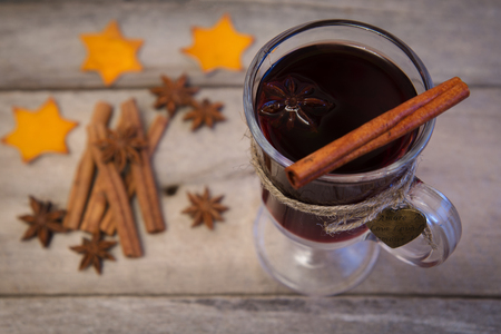 festive mulled wine with spices for a loved one. On a wooden backgroundの写真素材