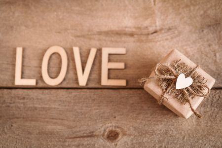 gift your beloved with a heart on a wooden tableの写真素材
