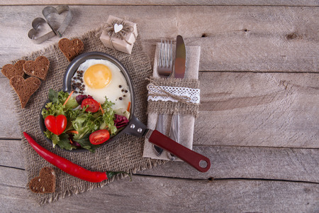 Breakfast for a loved one, scrambled eggs with green saladの写真素材