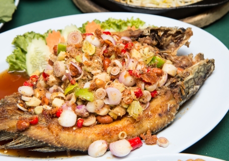 Striped snakehead fish with Spices on the plateの写真素材