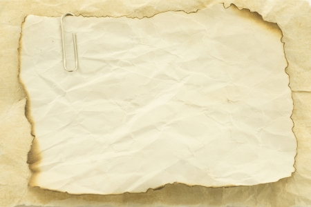 Old paper with burn marks framework for message notes の写真素材