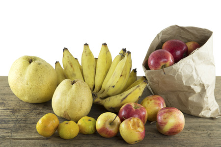 mixed fruits of natural light on wood backgroundの写真素材