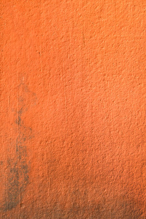 Background of orange stone wall texture の写真素材
