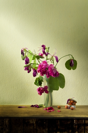 still life art with  flower in glass on wooden tableの写真素材