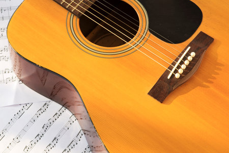 Guitar and musical notes on paperの写真素材