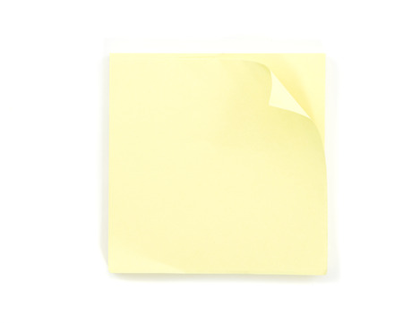 Yellow stick note isolated on white の写真素材