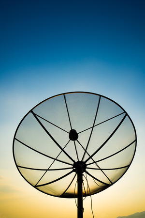 satellite dish on sunset blue sky, skiesの写真素材