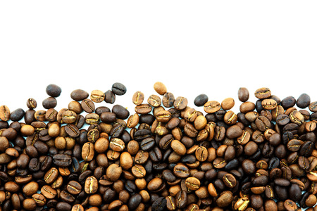 stripe of coffee beans isolated on whiteの写真素材