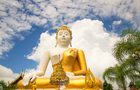 Large sitting Buddha in ChiangMai Thailand with sky の写真素材