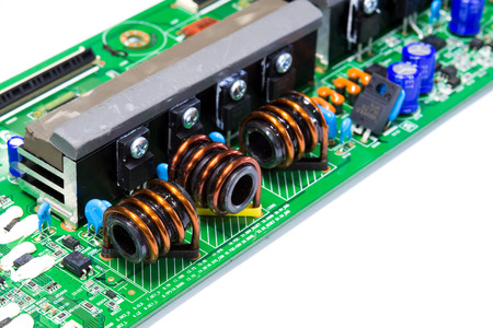 Integrated Circuit, inductor ferrite core in electronic circuit board isolate on whiteの写真素材